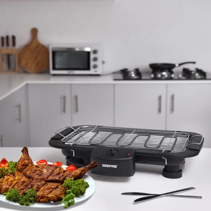 Geepas 2000W electric barbecue grill table grill features auto-thermostat control, overheat protection, a detachable heating element, and a space-saving design.