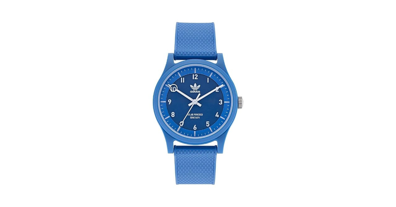 Adidas Originals Project One is a unisex watch made with silicone material. It has a solar-powered blue face.